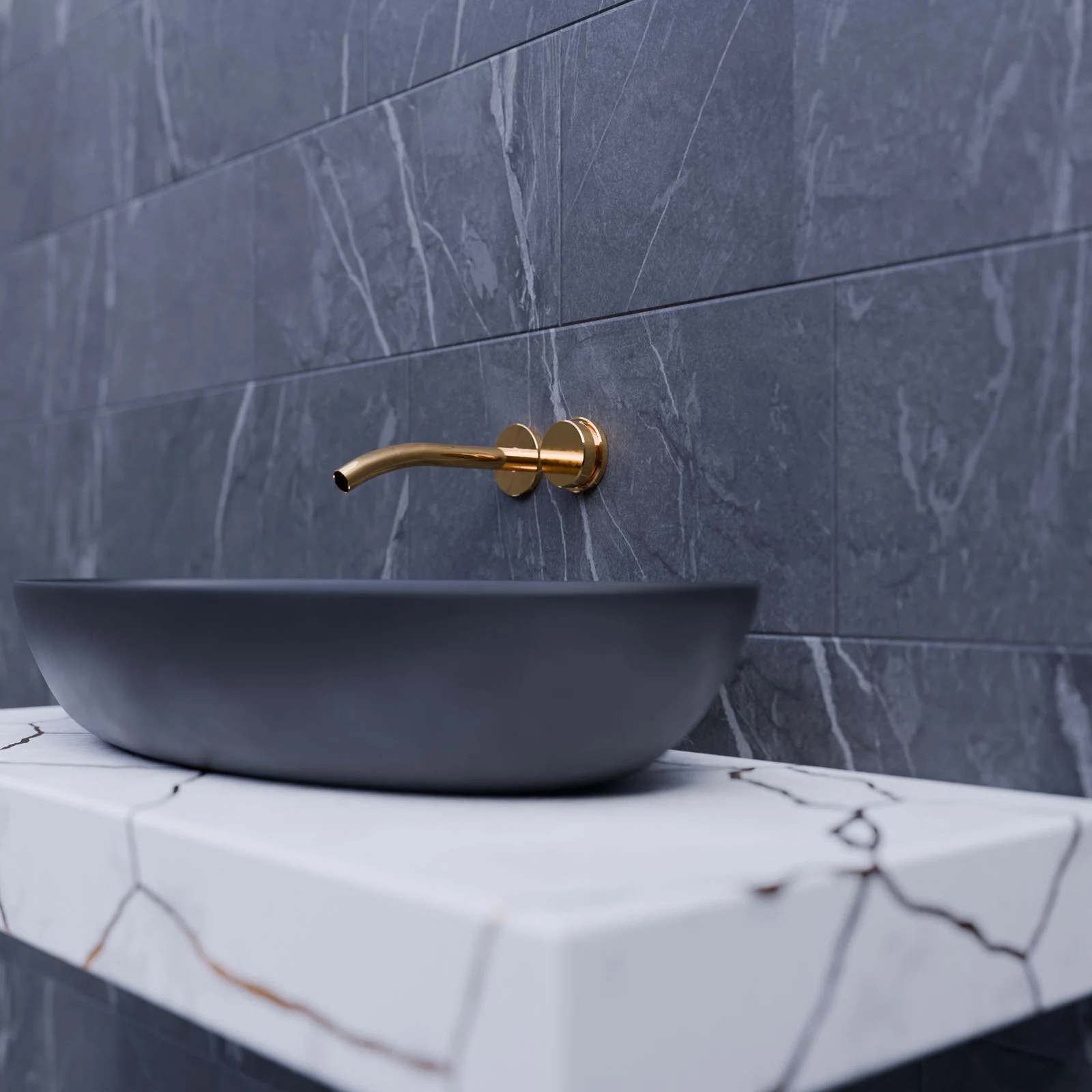 Elegant bathroom sink with gold faucet on marble slab and gray tiles