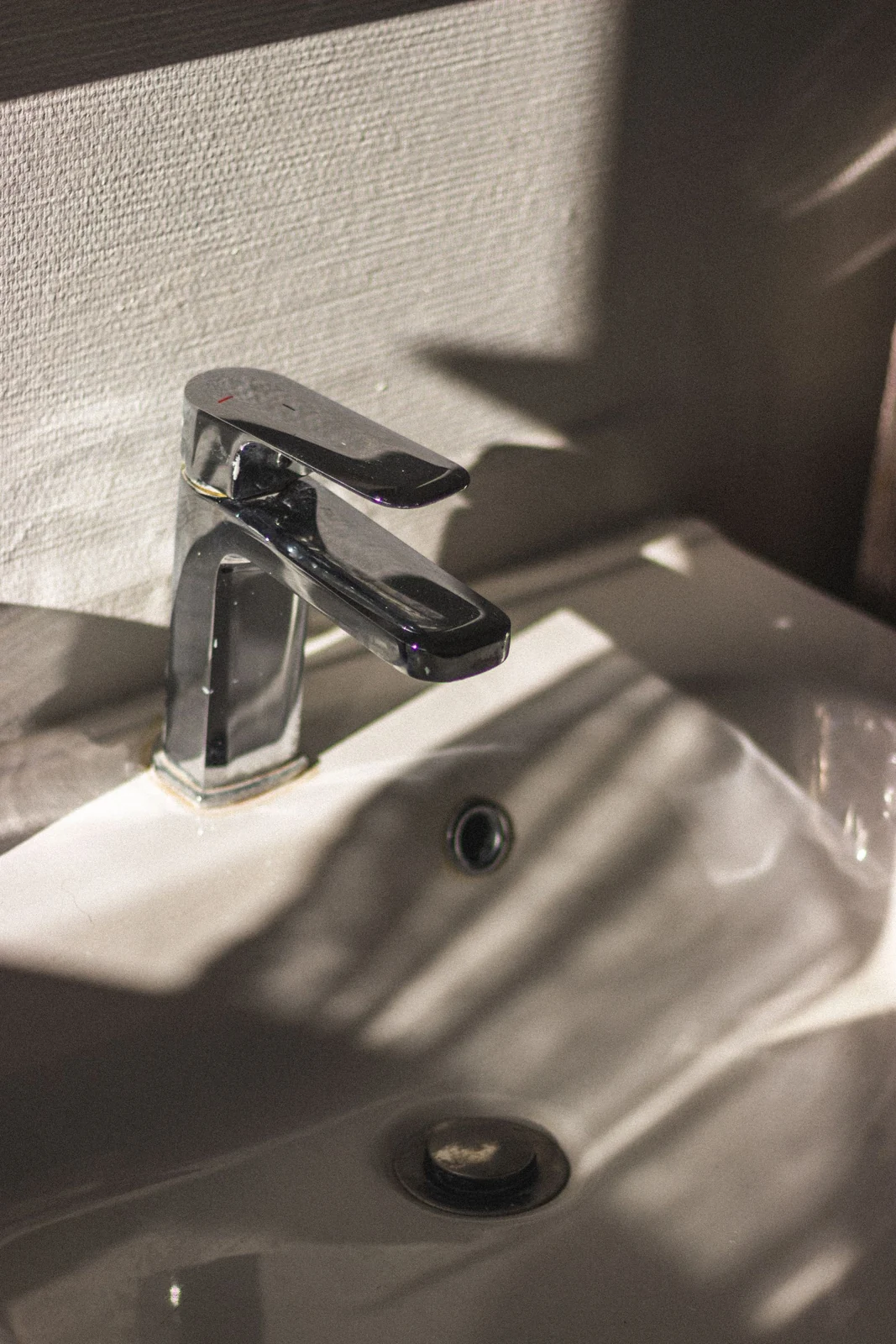Bathroom tap and basin